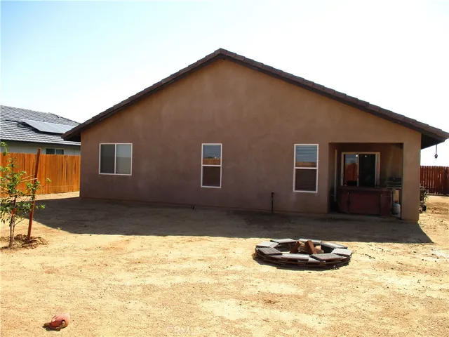 a view of a swimming pool and an outdoor space
