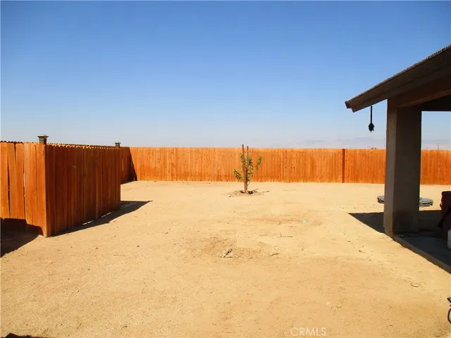 an aerial view of houses with a ocean