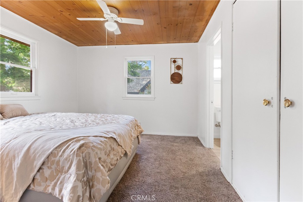 1777 Sparrow Road Wrightwood, CA 92397 - Photo 13 of 44 a bedroom with a bed and a window