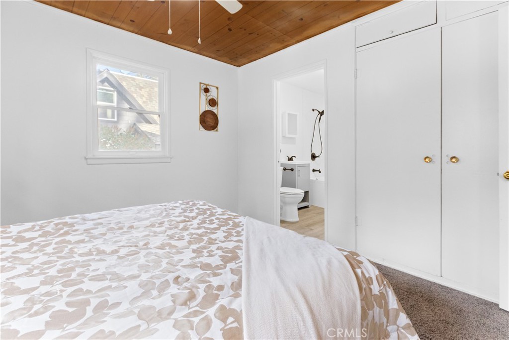 1777 Sparrow Road Wrightwood, CA 92397 - Photo 14 of 44 a bedroom with a bed and a window