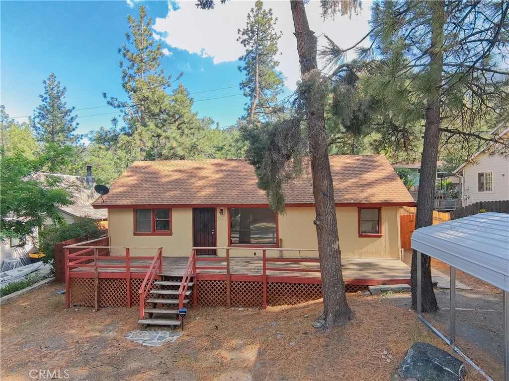 1777 Sparrow Road Wrightwood, CA 92397 - Photo 2 of 44 a front view of a house with a garden