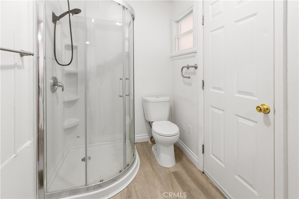 1777 Sparrow Road Wrightwood, CA 92397 - Photo 22 of 44 a bathroom with a granite countertop shower and a toilet