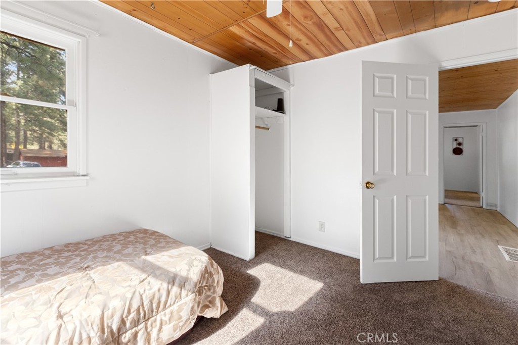 1777 Sparrow Road Wrightwood, CA 92397 - Photo 24 of 44 a view of a livingroom with wooden floor and a window