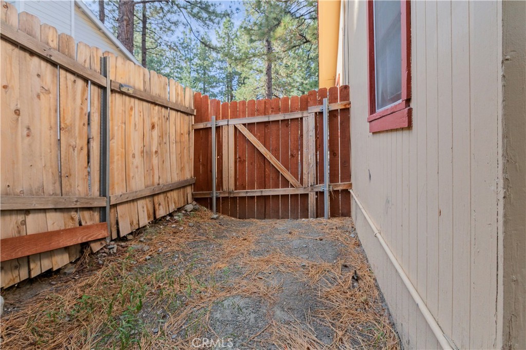 1777 Sparrow Road Wrightwood, CA 92397 - Photo 36 of 44 a view of a house with wooden fence