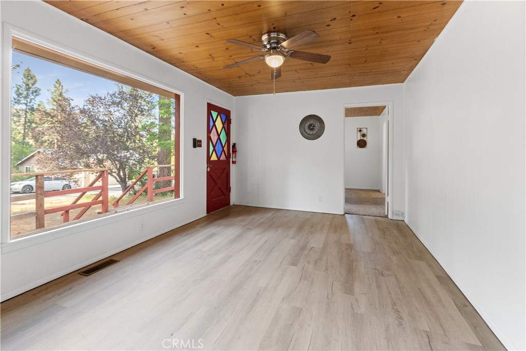 1777 Sparrow Road Wrightwood, CA 92397 - Photo 7 of 44 wooden floor in an empty room with a window