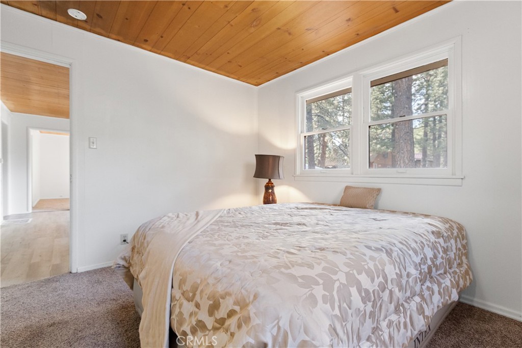 1777 Sparrow Road Wrightwood, CA 92397 - Photo 10 of 44 a bedroom with a bed and a window