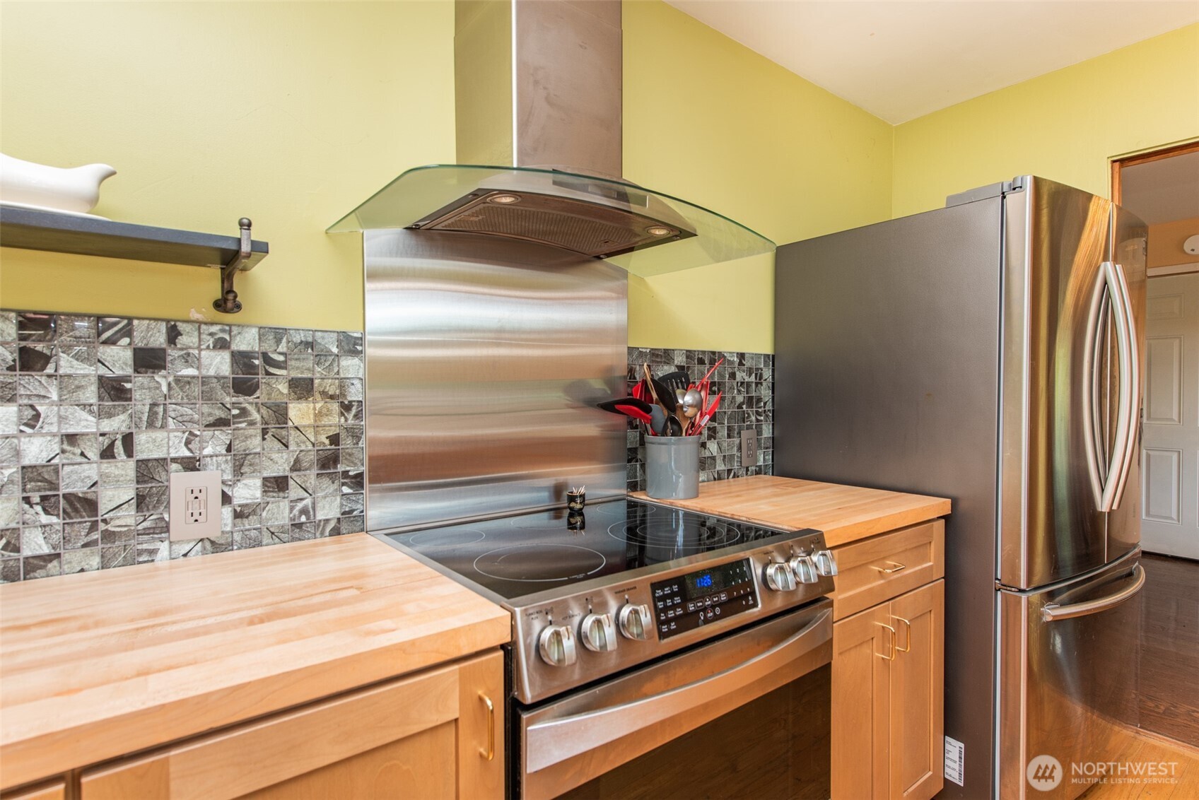 307 East Fir Street Sequim, WA 98382 - Photo 10 of 29 a kitchen with stainless steel appliances granite countertop a refrigerator and a stove