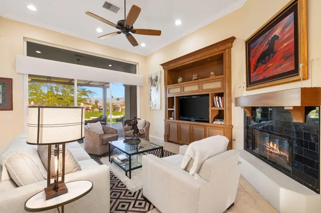 a kitchen with a sink a refrigerator and chairs