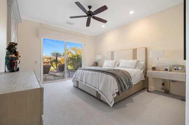 a view of a livingroom with workspace and a window