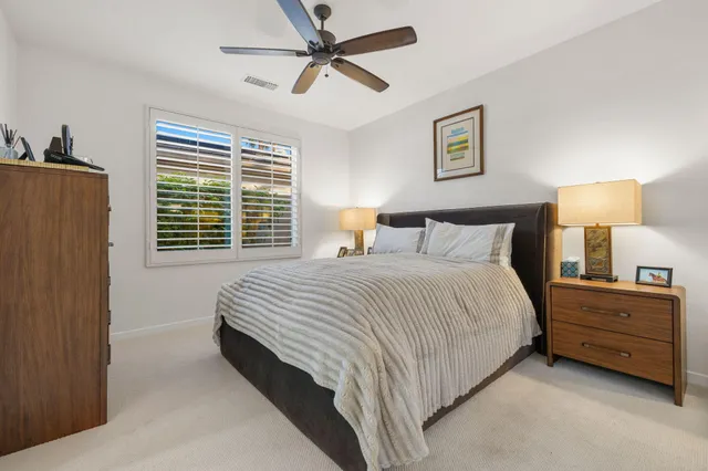 a view of an houses with a lush green hillside