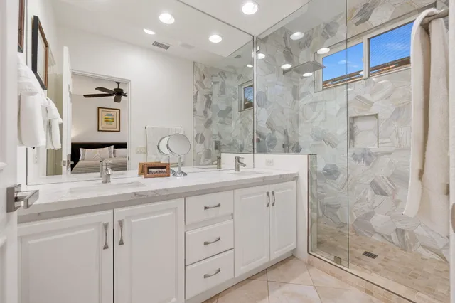 a view of a house with backyard porch and sitting area