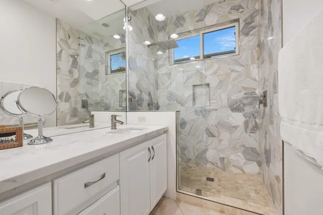 a view of backyard with swimming pool and outdoor seating