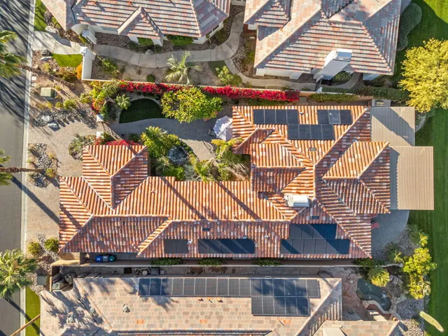 a view of a patio with couches chairs and a table and chairs