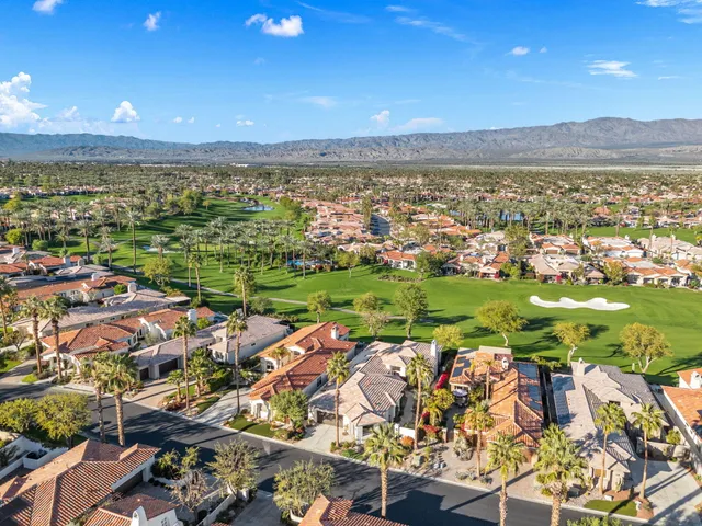 a outdoor space with the couches and dining table