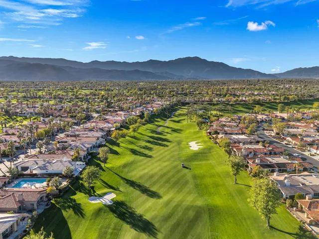 a view of washer and dryer with yard in the back