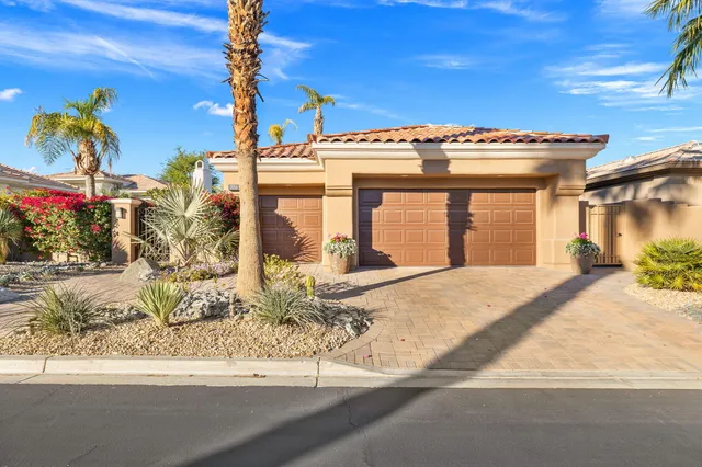 a view of a pathway of a house with a fountain