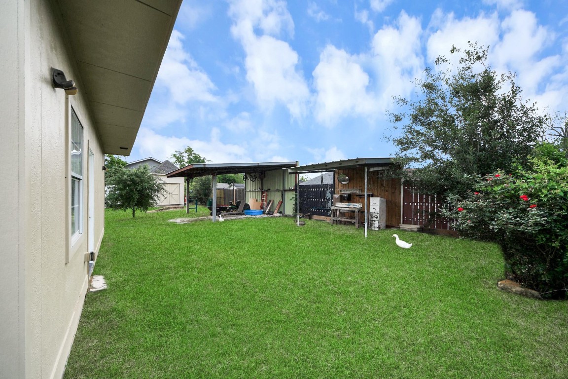 2608 Bostic Street Houston, TX 77093 - Photo 16 of 37 a view of a house with backyard porch and garden