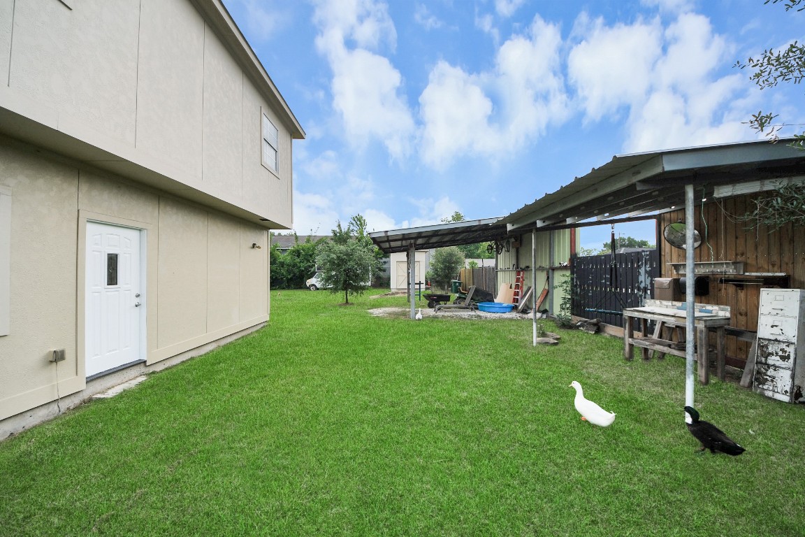 2608 Bostic Street Houston, TX 77093 - Photo 17 of 37 a backyard of a house with table and chairs