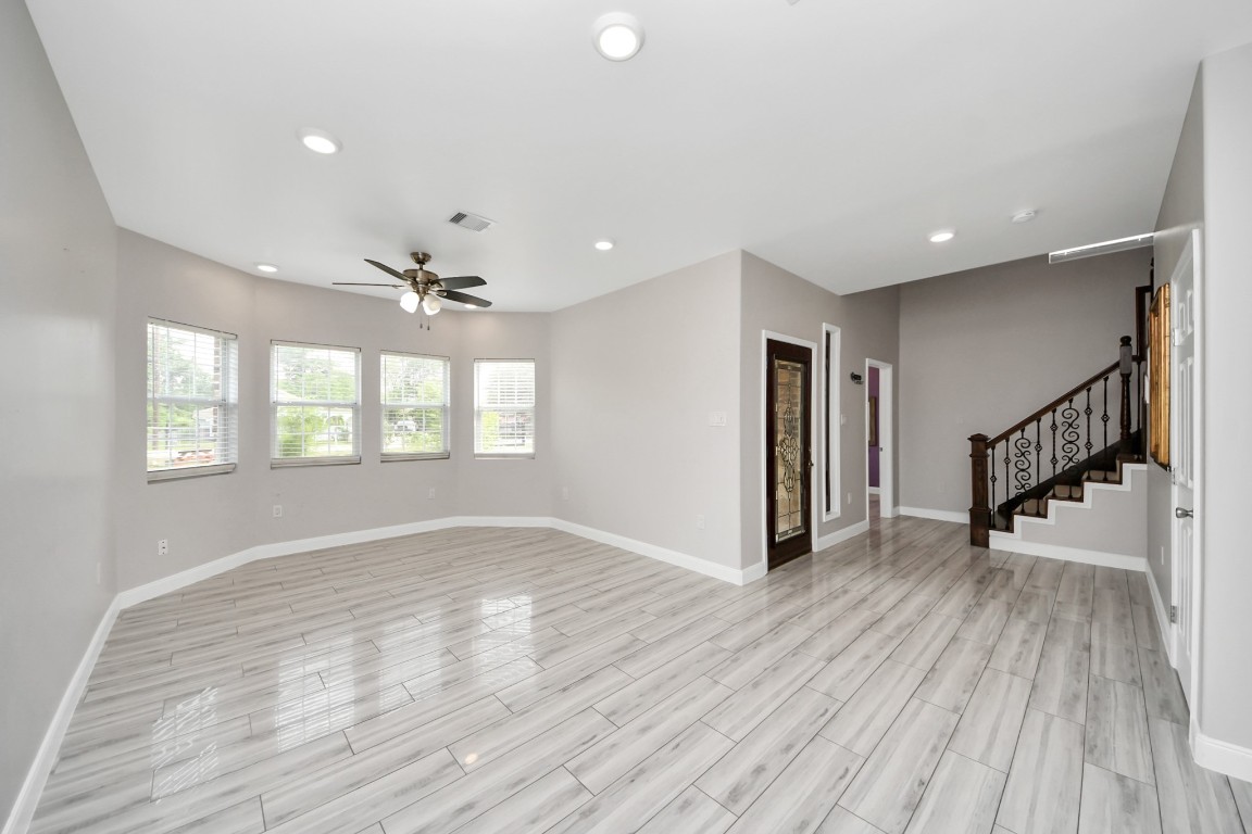 2608 Bostic Street Houston, TX 77093 - Photo 22 of 37 a view of an empty room with wooden floor and a window
