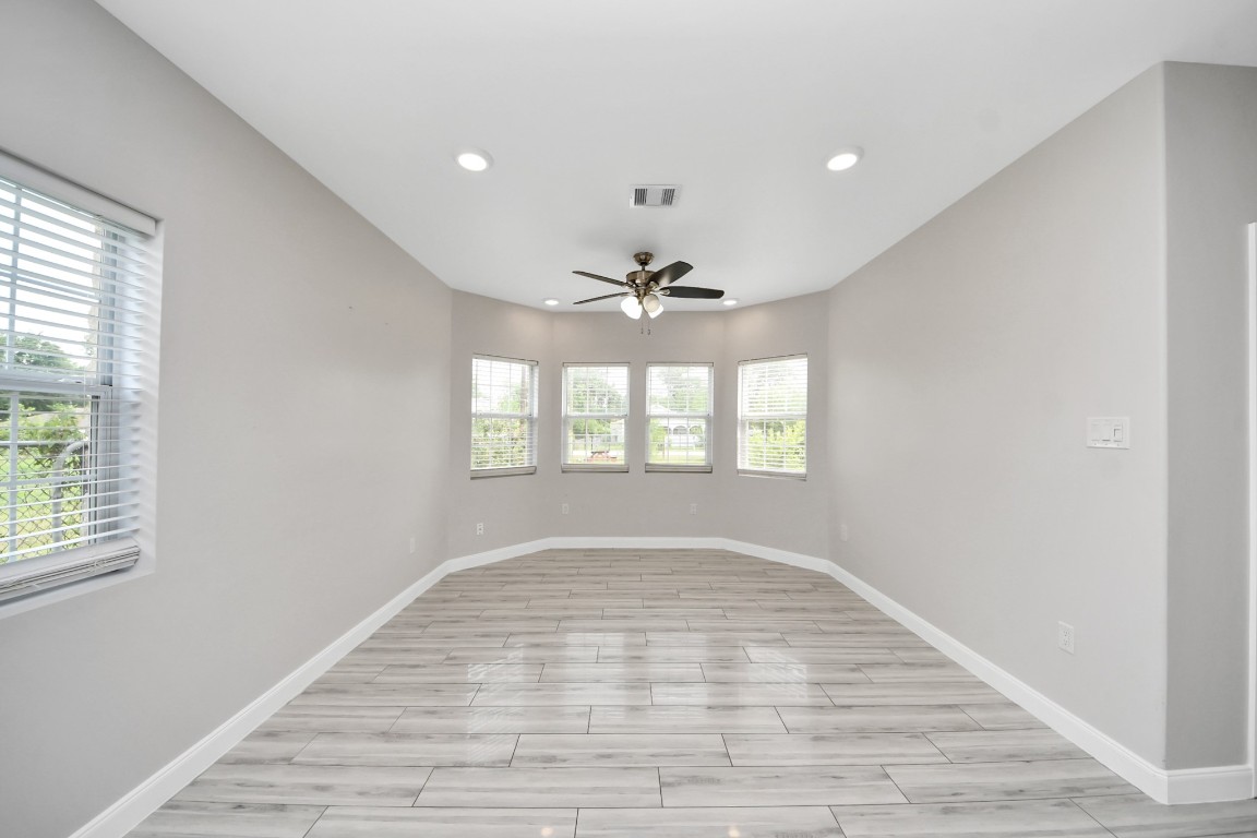 2608 Bostic Street Houston, TX 77093 - Photo 23 of 37 wooden floor in an empty room with a window