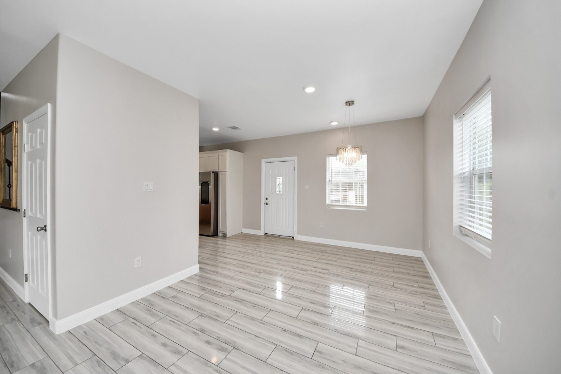 2608 Bostic Street Houston, TX 77093 - Photo 24 of 37 a view of an empty room with wooden floor and a window