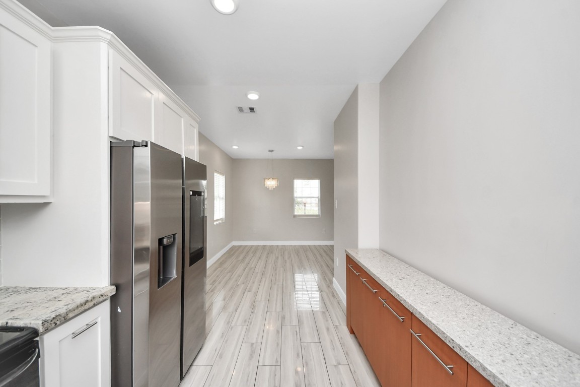 2608 Bostic Street Houston, TX 77093 - Photo 30 of 37 a view of a kitchen cabinets a counter top space and stainless steel appliances