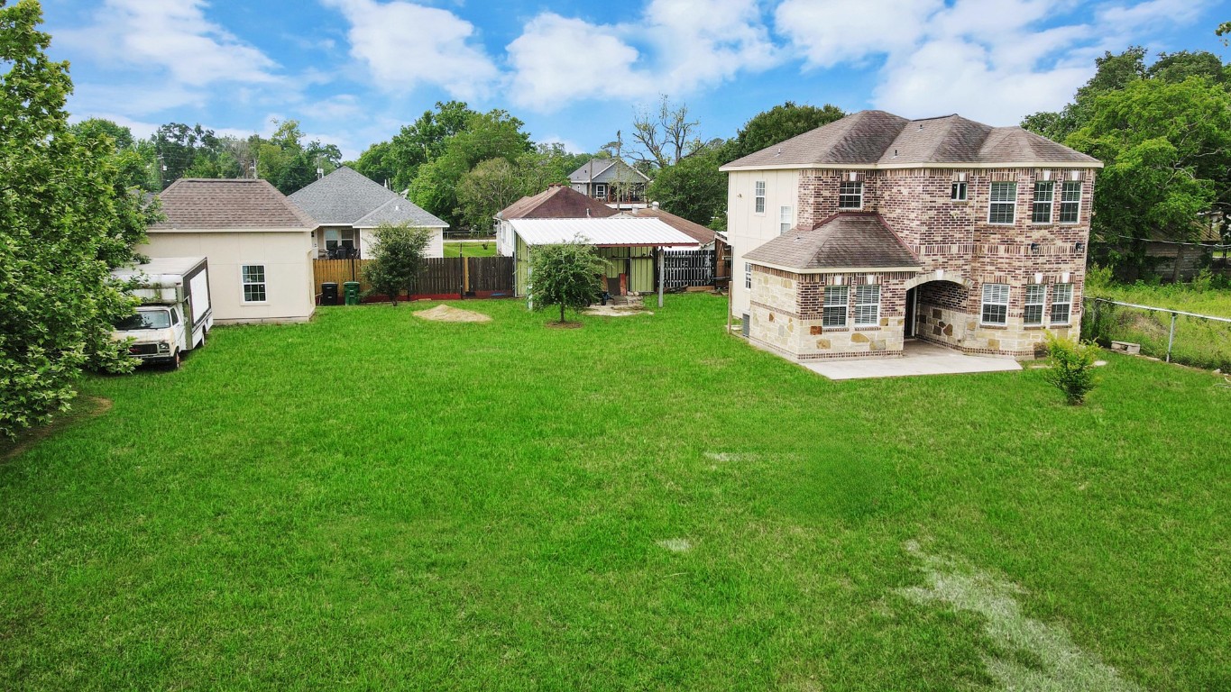 2608 Bostic Street Houston, TX 77093 - Photo 5 of 37 a front view of a house with garden