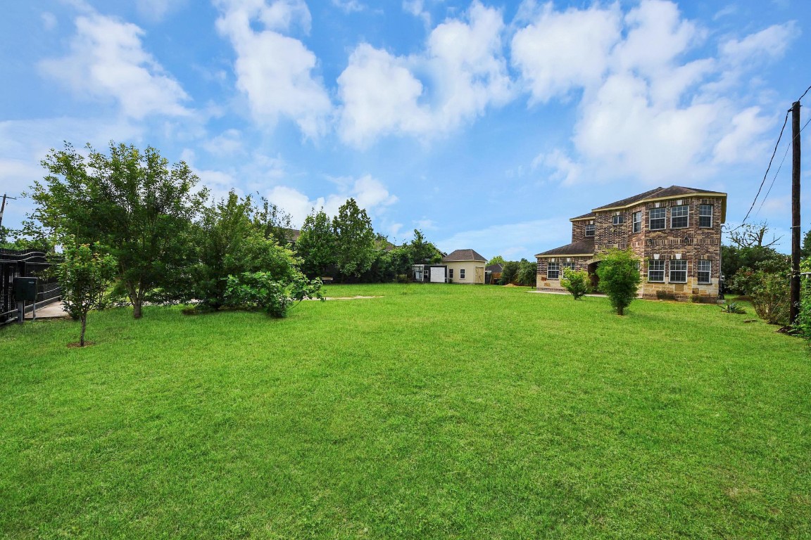 2608 Bostic Street Houston, TX 77093 - Photo 7 of 37 a view of a garden with a building in the background