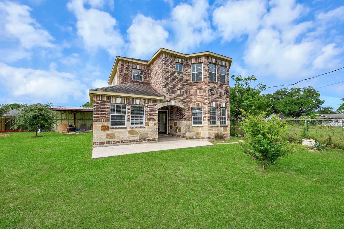 2608 Bostic Street Houston, TX 77093 - Photo 9 of 37 a front view of a house with a garden