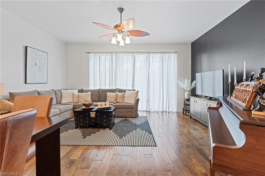 941 Hampton Circle, Unit 109 Naples, FL 34105 - Photo 12 of 27 a living room with furniture