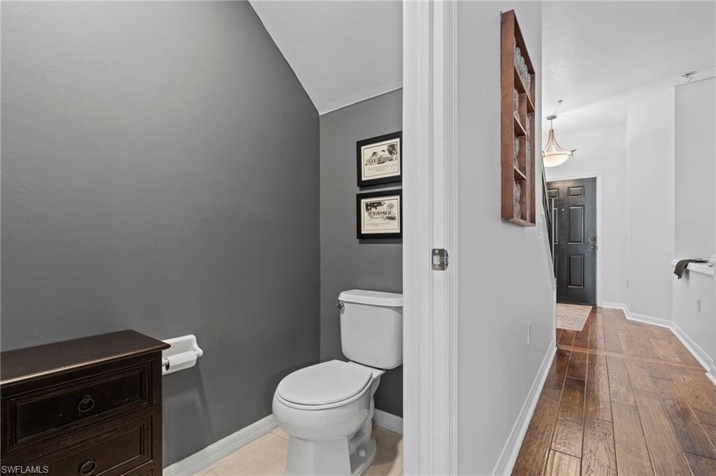 941 Hampton Circle, Unit 109 Naples, FL 34105 - Photo 18 of 27 a bathroom with a toilet and a shower