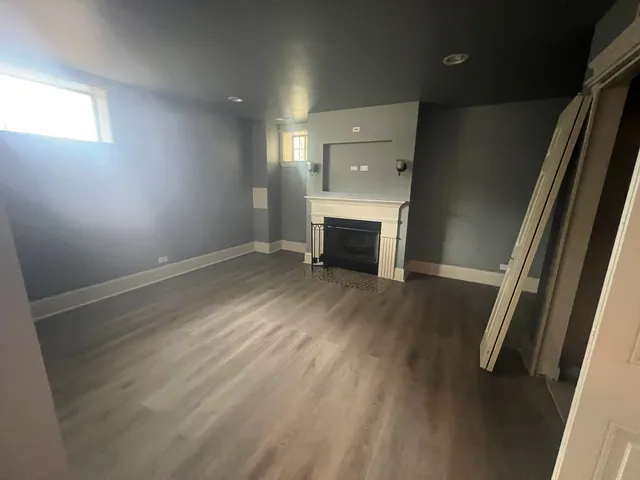 a bathroom with a granite countertop toilet sink and shower