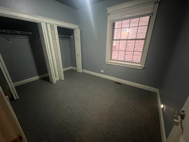 a bathroom with a granite countertop sink toilet a mirror and shower