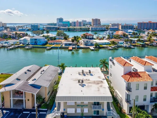 an aerial view of a house with a lake view