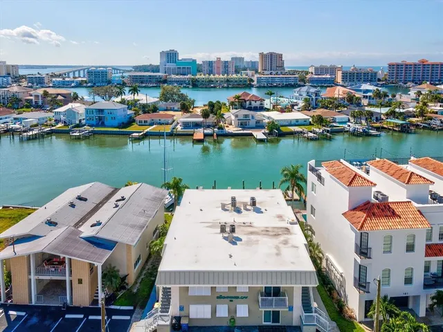 an aerial view of a house with a lake view