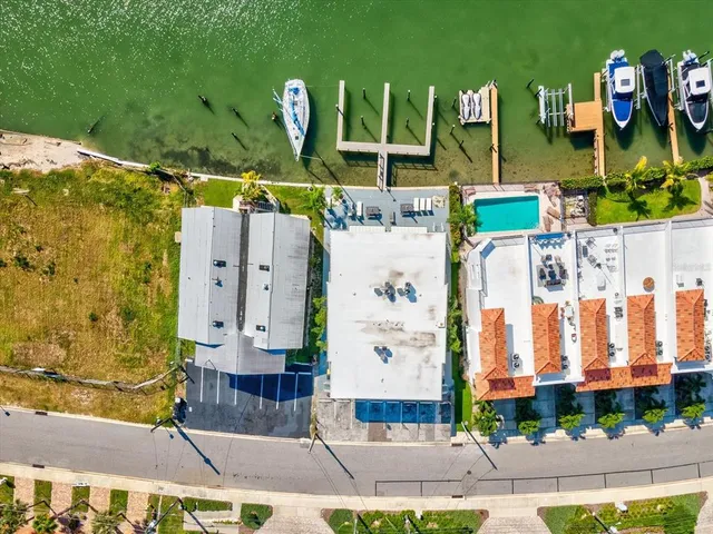 an aerial view of a house with a lake view