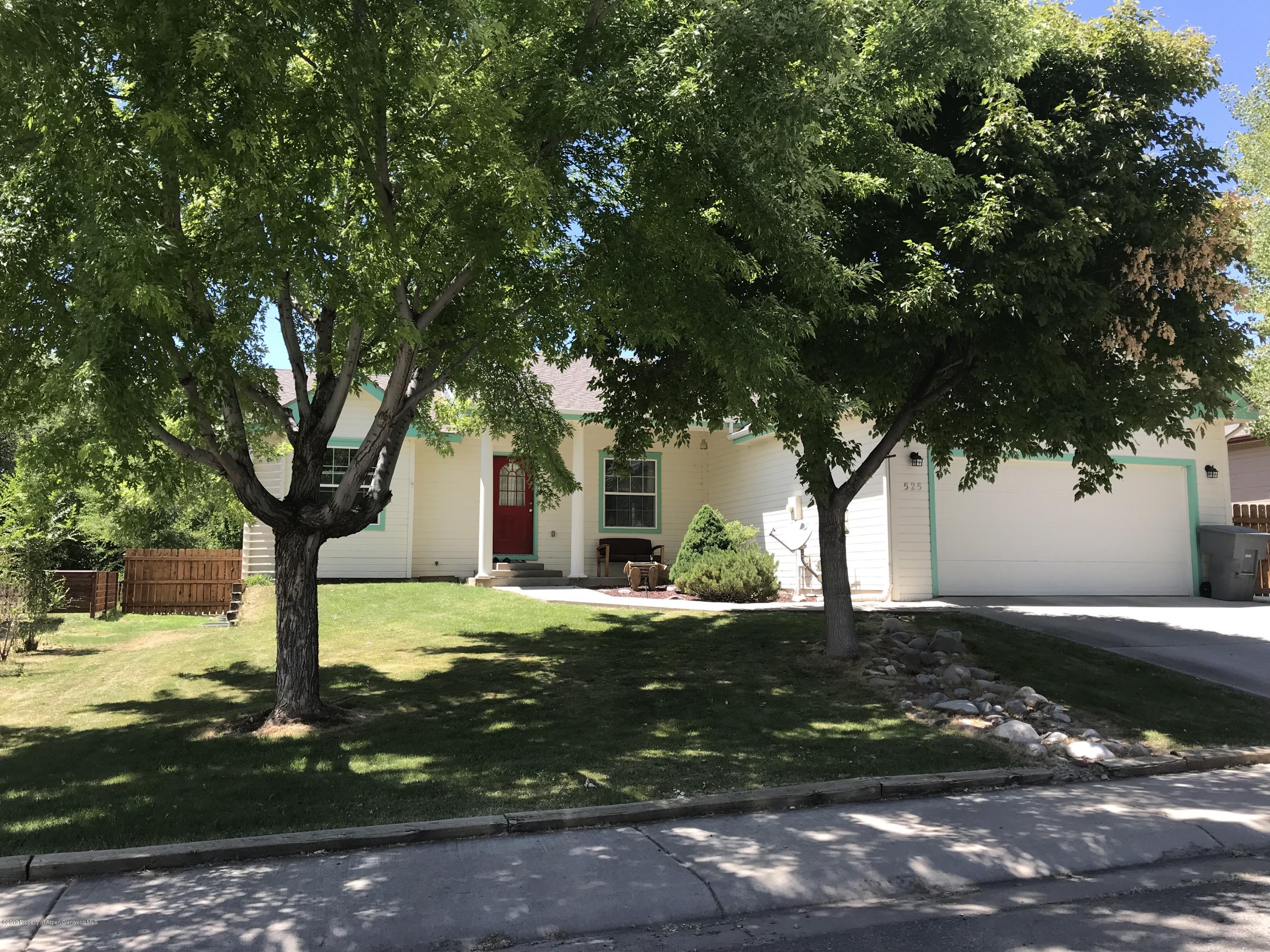 525 Birch Court Rifle, CO 81650 - Photo 2 of 17 a front view of a house with garden