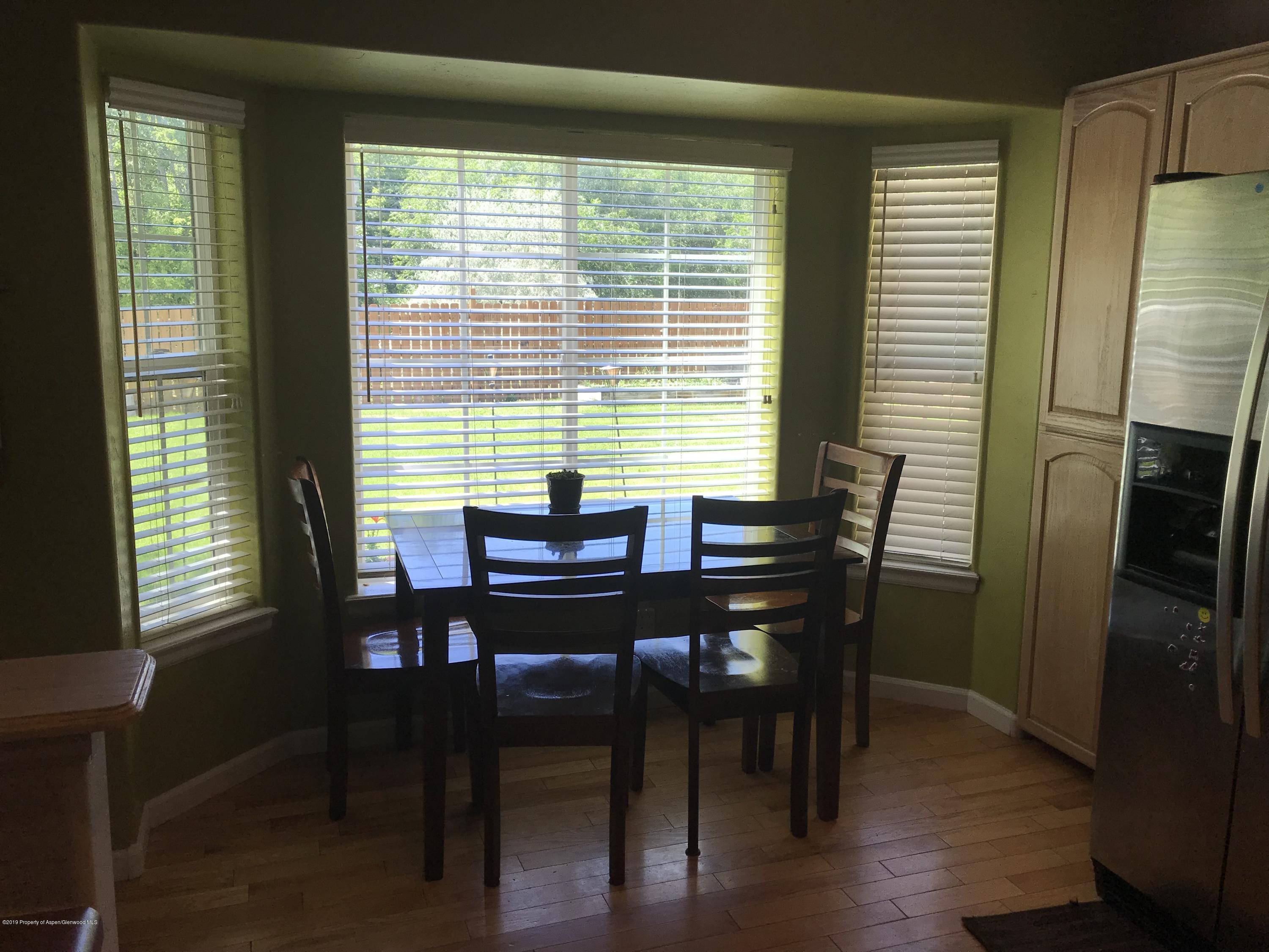 525 Birch Court Rifle, CO 81650 - Photo 4 of 17 a view of a dining room with furniture and window