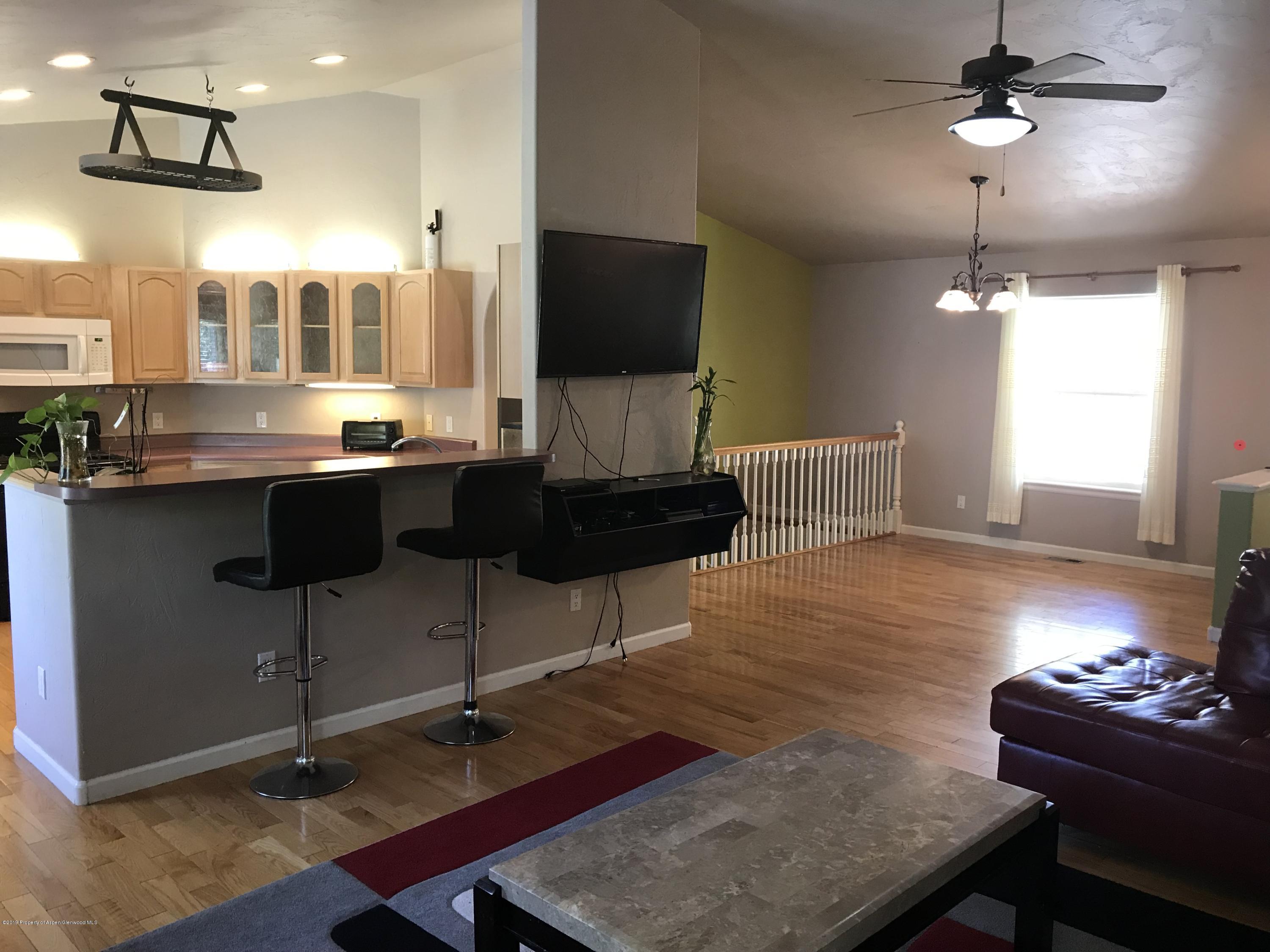 525 Birch Court Rifle, CO 81650 - Photo 8 of 17 a living room with furniture and a flat screen tv