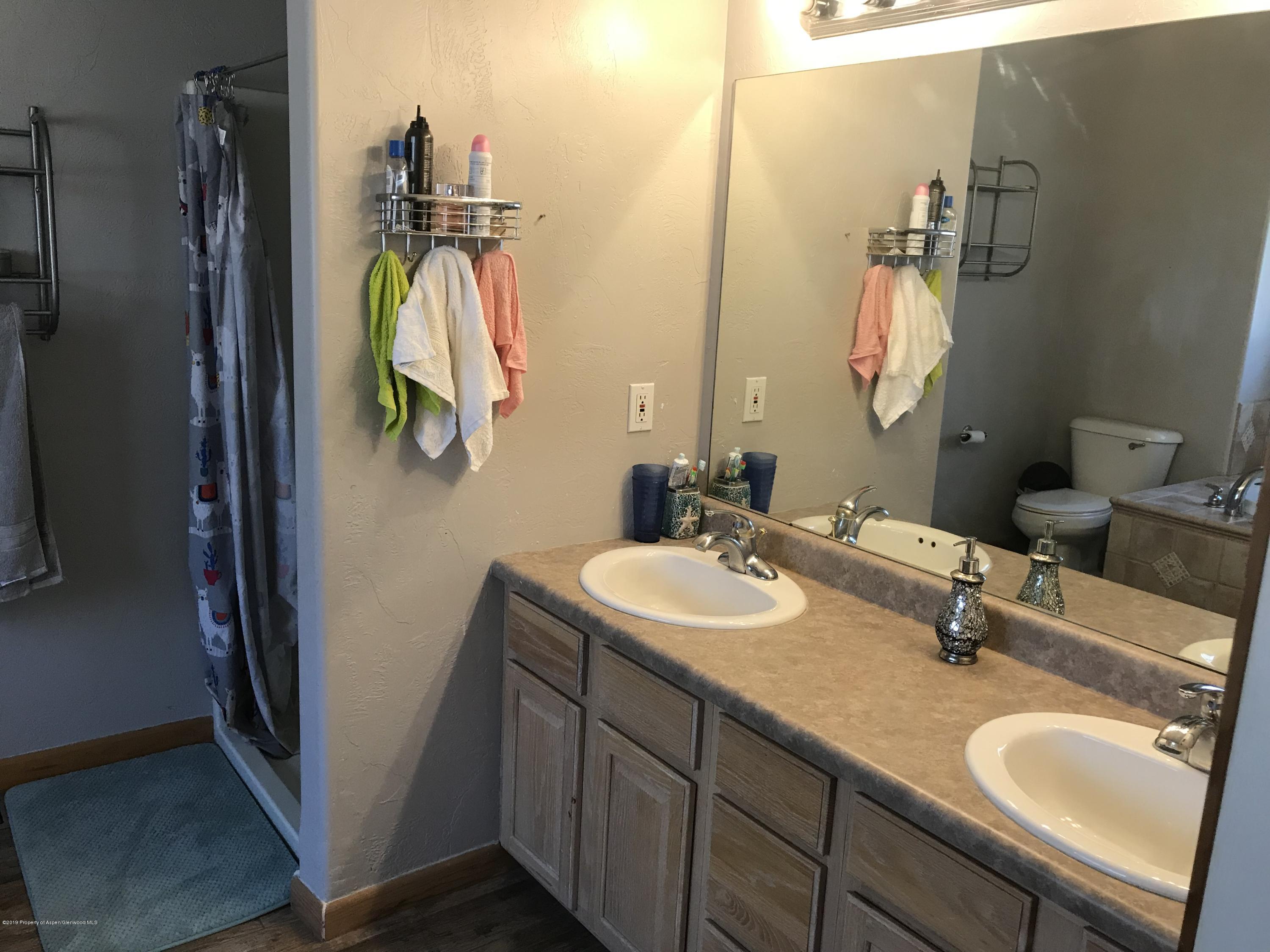 525 Birch Court Rifle, CO 81650 - Photo 10 of 17 a bathroom with a sink and a mirror