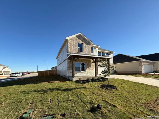 a bed room with a bed and a chair