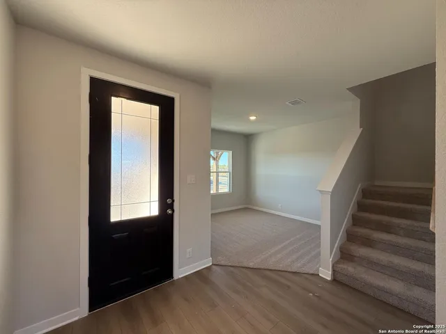 a large kitchen with kitchen island a sink stainless steel appliances and a counter top