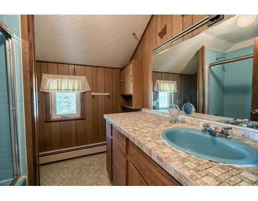 7 Ellis Road Southbridge, MA 01550 - Photo 18 of 30 a bathroom with a granite countertop sink a mirror and shower