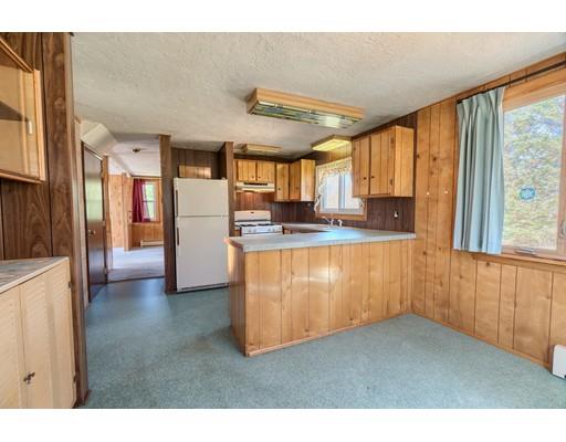 7 Ellis Road Southbridge, MA 01550 - Photo 5 of 30 a kitchen with stainless steel appliances granite countertop a refrigerator a sink and a stove with wooden floor