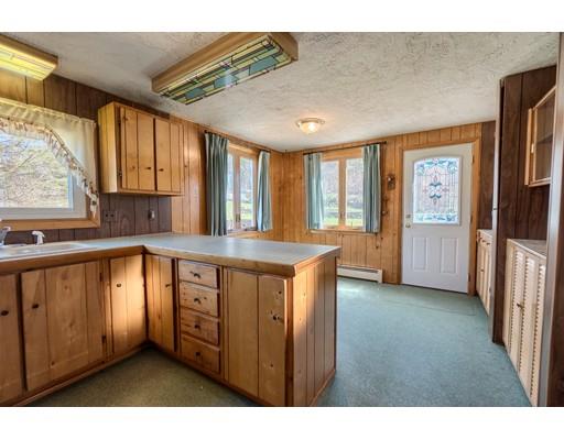 7 Ellis Road Southbridge, MA 01550 - Photo 6 of 30 a kitchen with stainless steel appliances granite countertop a stove a sink and a refrigerator