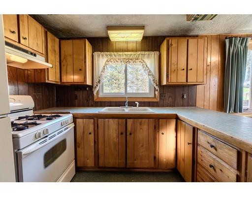 7 Ellis Road Southbridge, MA 01550 - Photo 7 of 30 a kitchen with a stove a sink and a window