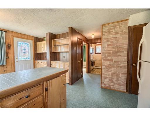 7 Ellis Road Southbridge, MA 01550 - Photo 8 of 30 a kitchen view with granite countertop cabinets and refrigerator