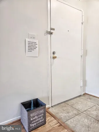 a view of a room with wooden floor and bathroom