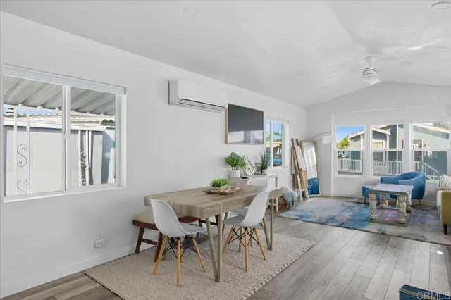 a view of a dining room with furniture window and outside view
