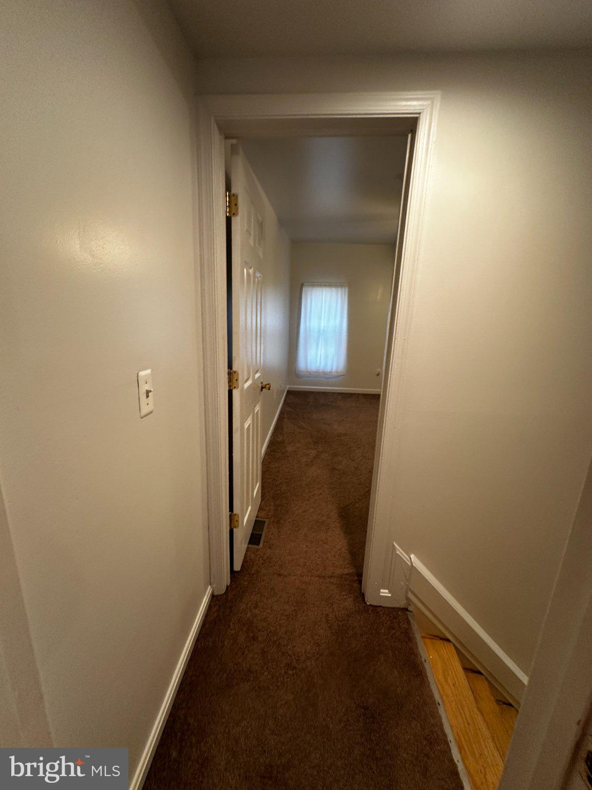1527 West 36th Street Baltimore, MD 21211 - Photo 24 of 26 a view of a hallway with wooden floor